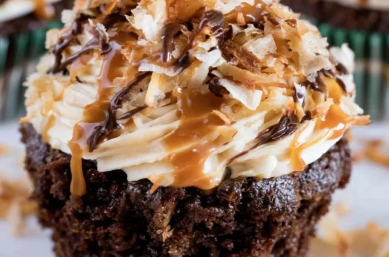 Delicious Samoas Cupcakes topped with caramel and toasted coconut.