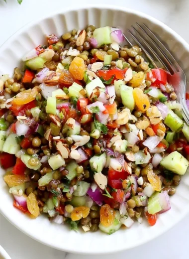 Colorful and fresh lentil salad with vegetables and dressing