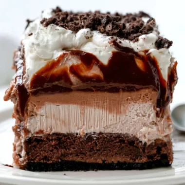 Decadent Chocolate Mud Bars topped with chocolate and nuts