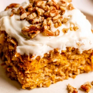 Delicious Protein Pumpkin Baked Oatmeal topped with nuts and spices